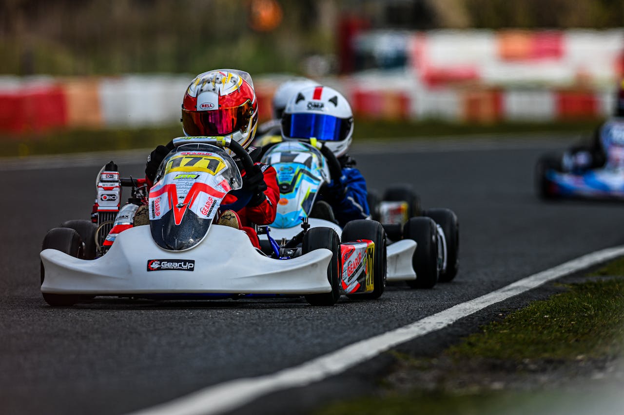 Dynamic go-kart race showcasing competition and speed on an outdoor circuit.